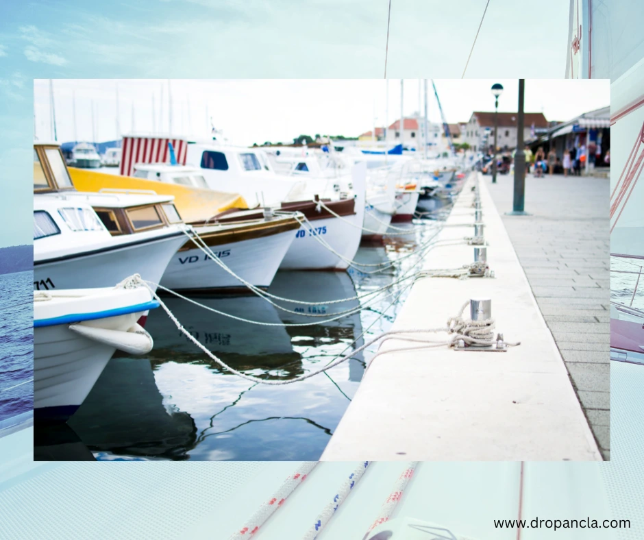 Colorful boats docked in a scenic harbor. Find your dream boat at Drop Ancla